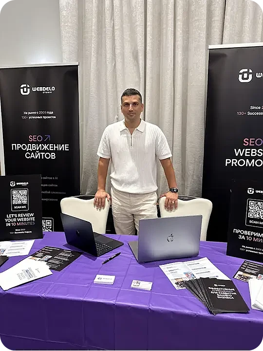 Webdelo representative at the company booth during American Business Expo 2025